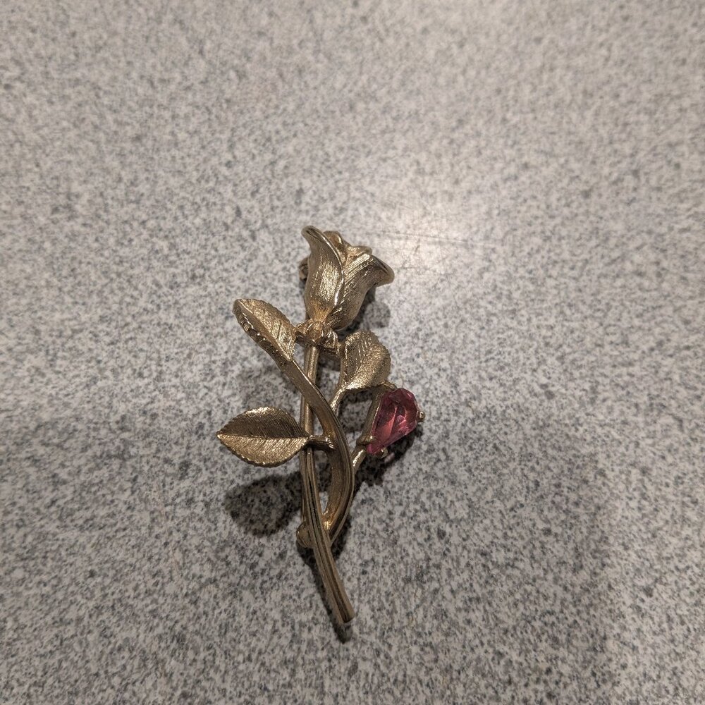 golden rose brooch
